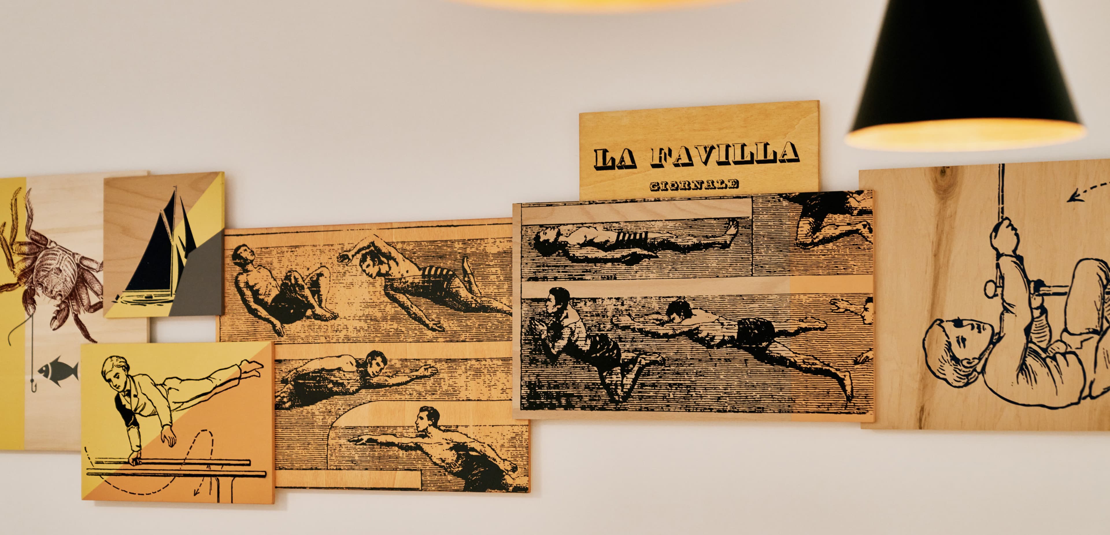 xZu sehen ist eine Detailaufnahme eines Kunstwerks, das in den Apartments ausgestellt ist. Es beschreibt das Hauptthema hinter dem Namen Ginnastica: Menschen, die Sport und Gymnastik in verschiedenen Disziplinen betreiben.