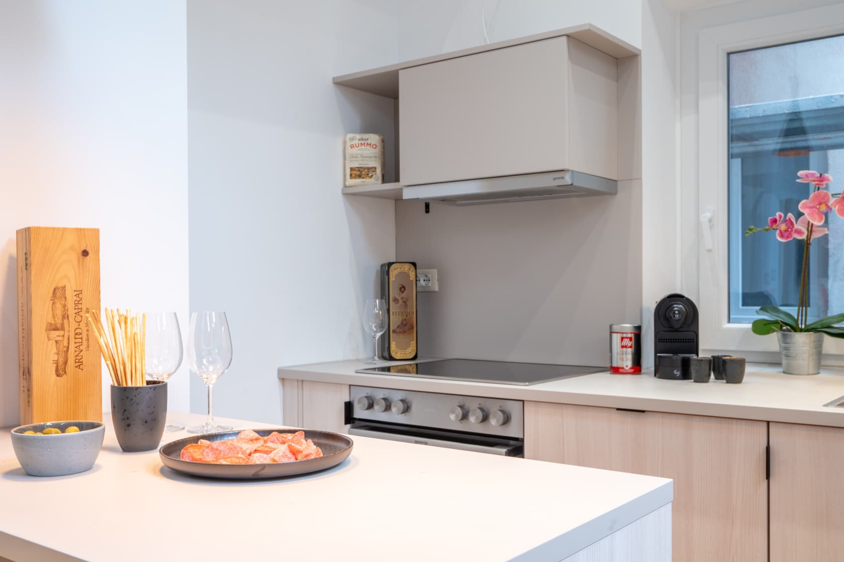 Pictured is a fully equipped kitchen with a stove, kitchen island and plenty of work space to cook a full meal.
